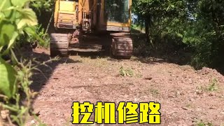 The rural uncle asked the boy to repair the road and change the dirt road into a cement road