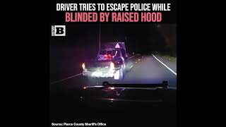 Driver Tries to Escape Police While Blinded by Raised Hood