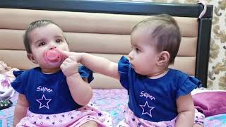 Funniest Twin Baby Girls Share a Pacifier