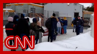 CNN follows migrants illegally entering Canada from New York road