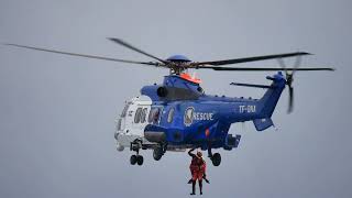 Icelandic Coast Guard shows rescue with a helicopter of a man from the sea -  harbour in Reykjavik