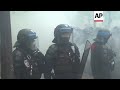 tear gas and smoke bombs fired at paris protest