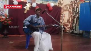 Old Man Playing Guitar And Singing in Jaffna