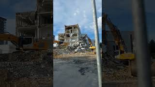 Huge excavators demolishing an old police station In Oulu, Finland.