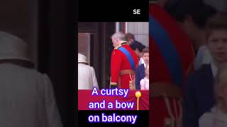 A curtsy and a bow to the queen at Buckingham palace balcony prince Harry and Meghan Markle