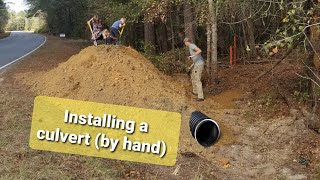 Family installs culvert (BY HAND) on 18 acres of RAW LAND | Building an off grid homestead