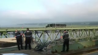 Tractor trailer crashes through a guardrail on the Delaware Memorial Bridge into the water below