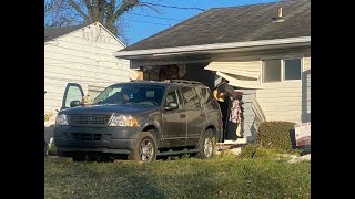 Car backs into home, trapping teenage girl inside