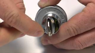 Removing a key lock and tumbler from a GM-style ignition switch.