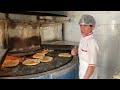 process of baking barbari bread with a young baker