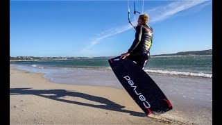 Flying over the beach with my Carved board on.