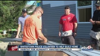 Whitestown police volunteer to help build home