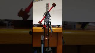 Miniaturized pendulum-regulated striking mechanism