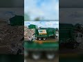 Green Garbage truck dumping