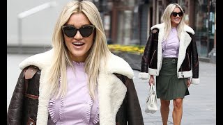 Ashley Roberts looks chic in a khaki pleated skirt, lilac blouse and shearling jacket as she leaves