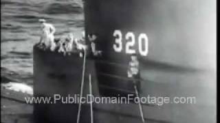 Transporting sick crewman from Submarine USS Bergall to USS Pocono Newsreel PublicDomainFootage.com