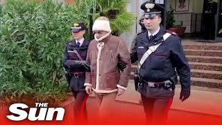 Mafia boss Messina Denaro detained and lead away by police in Sicily