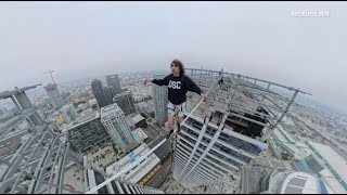 Daredevil walks between downtown L.A. skyscrapers, high above city skyline