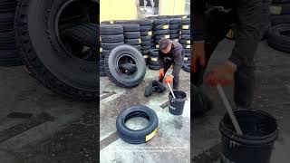 Insert the small vehicle tire into the large vehicle tire