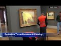 climate protesters throw mashed potatoes at monet painting