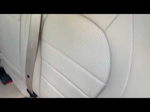 How do you get to the trunk in the back seat of a Mercedes?