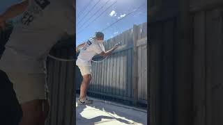 The only way to paint a fence, Spray. Using a Graco airless and 514fflp tip to keep overspray down.