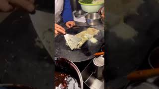 Famous Chinese street food - Yummy youtiao (Chinese doughnut) wrapped in Chinese egg crepe 煎饼包油条