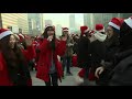 raw 100 s of dancing santas prepare big delivery