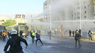 Chile protesters dispersed with water cannons as outcry continues | AFP