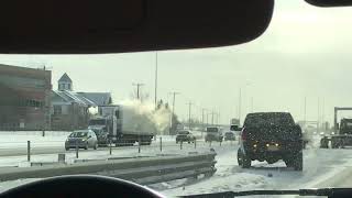 Calgary MVA | Red Toyota Tacoma being towed by AMA tow truck