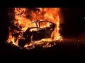 Bystander pulls man from burning car