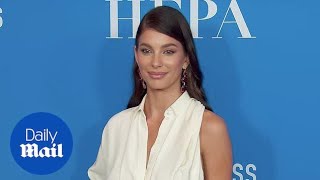 Camila Morrone glows in a single sleeved gown at HFPA event