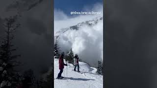 Massive avalanche tumbles toward skiers