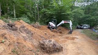 Removing a large stump with a Bobcat E48