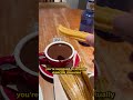 trying authentic churros in spain