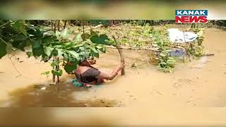 Temple, School Partially Submerged In Flood Water In Kujanga