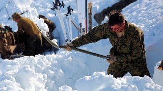 Marines and Sailors Construct Snow Caves