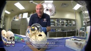 Medical Examiner's staff work to identify unknown human remains