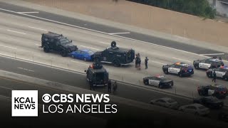 Watch Live: Police standoff shuts down 91 Freeway in Anaheim Hills