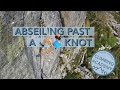 Abseiling past a knot