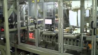 PCM HIGH SPEED ROBOTIC COIN FEEDING SYSTEM INTO OVAL CAROUSEL WITH INK-JET PRINTING