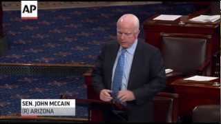 McCain Defends Clinton Aide