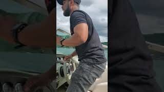 Nazdaq Brixx driving a boat in Lake George, NY July 4th 2021