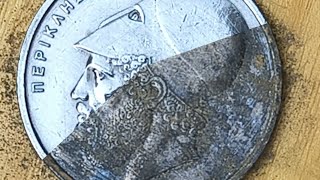 Restoration and polishing of the 1986 20 drachma Greek coin.