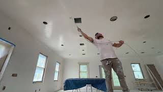 Spraying fresh plastered ceilings