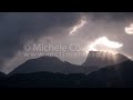 0079 time lapse sun beams over mountains 4k