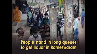 People stand in long queues to get liquor in Rameswaram