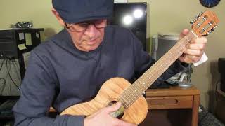 Kmise okoume tiger flame baritone ukulele.  DGBE.  Look and listen.