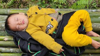 Poor baby. Struggling with life in the forest, preparing bamboo to make a fence.