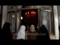 raising their hands in prayer muslim women outside makhdoom sahib shrine